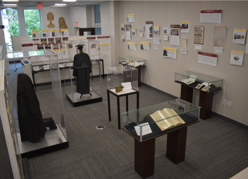 The exhibit space after installation, with staged exhibit cases and descriptive wall panels